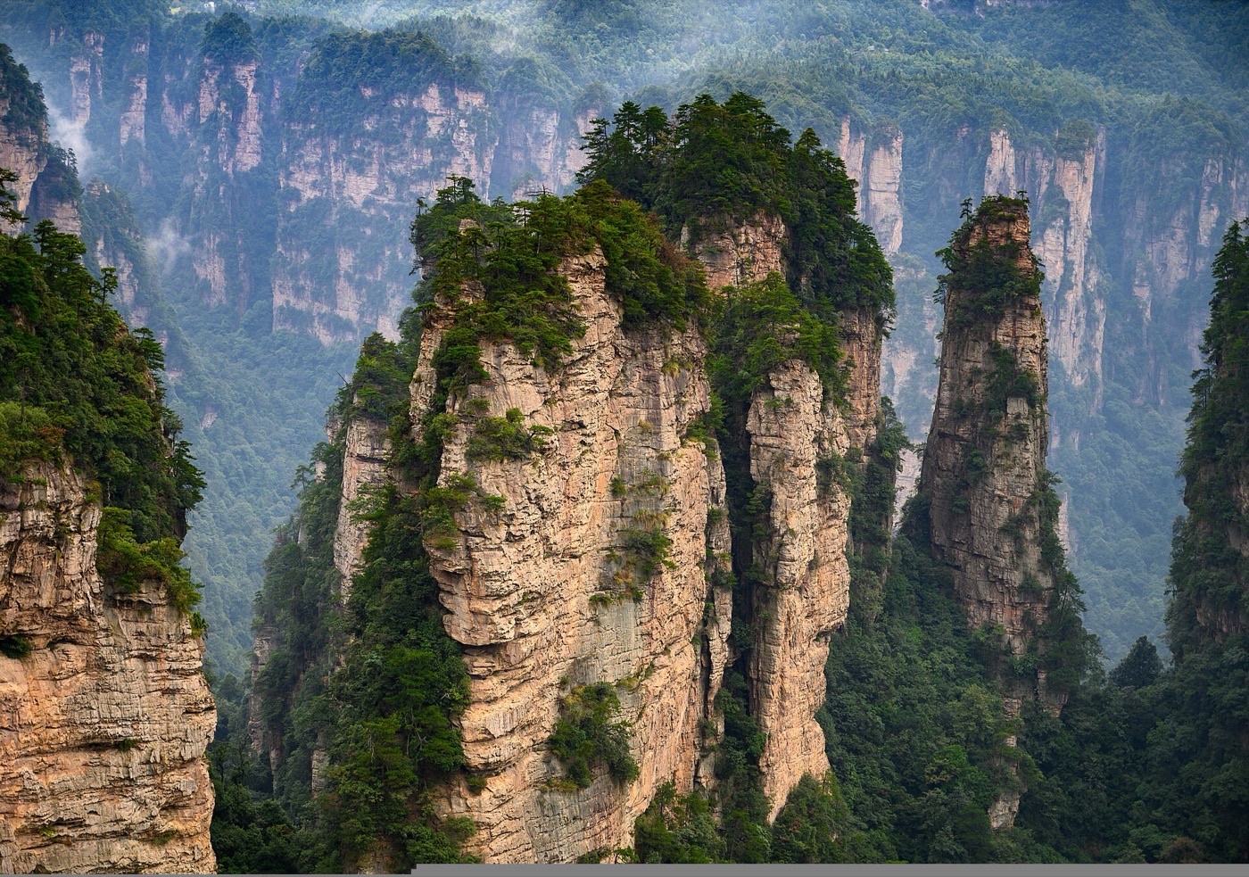 Tree-topped quartzite sandstone pillars in the Yuanjiajie area of Zhangjiajie National Forest Park, near the Avatar Hallelujah Mountain